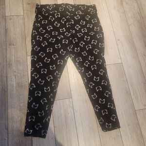 Torrid Black Leggings with White Skeleton Hand Heart Pattern